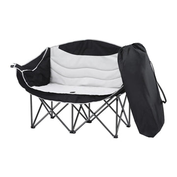 Black and white folding chair with carrying bag on a white background