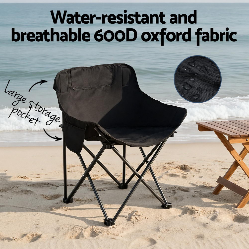 Black camping chair with water-resistant fabric on a beach