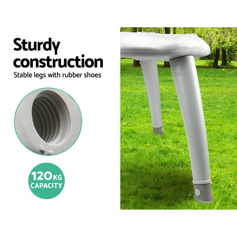 Stable legs with rubber shoes of a table on grass, highlighting durability and capacity.