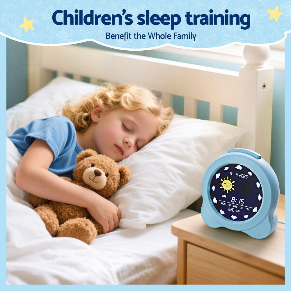 Child sleeping in bed with a teddy bear next to a blue children's sleep training clock.