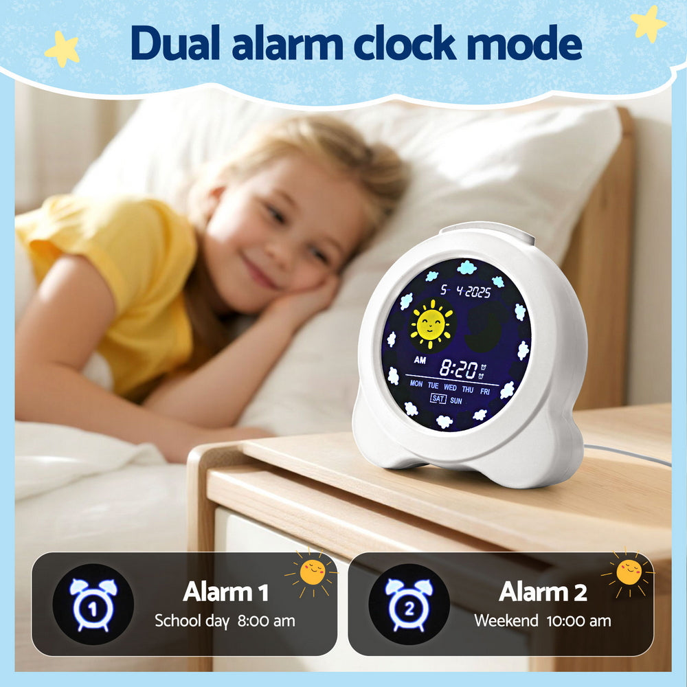 Children's dual alarm clock with digital display on a nightstand next to a child in bed.