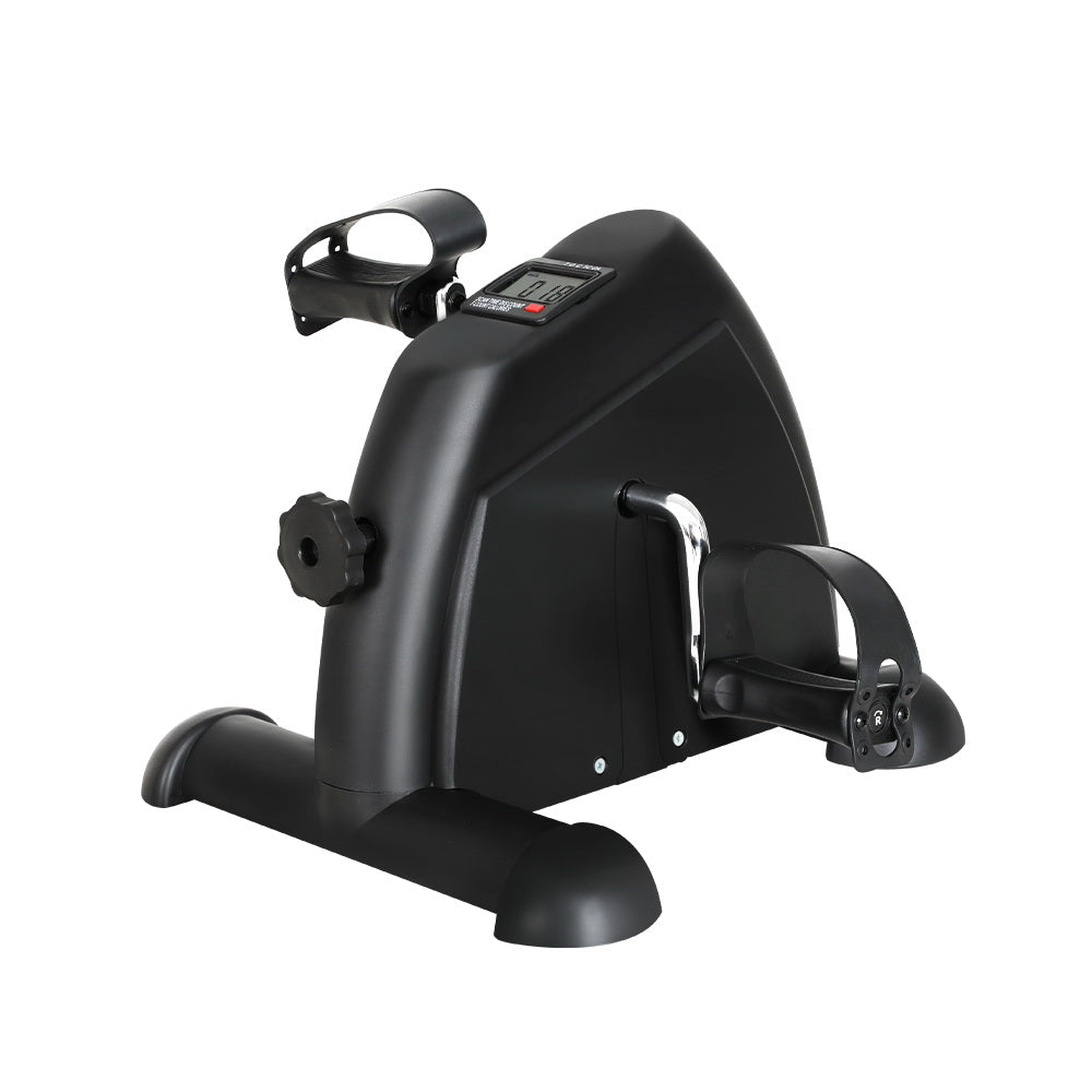 Black exercise bike with digital display on a white background