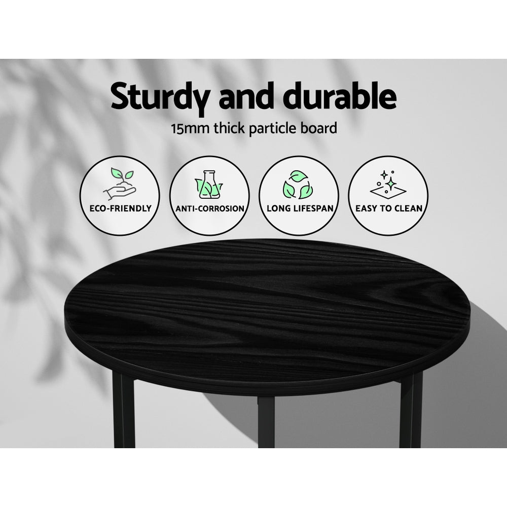 Black round table with durability features and icons on a light gray background