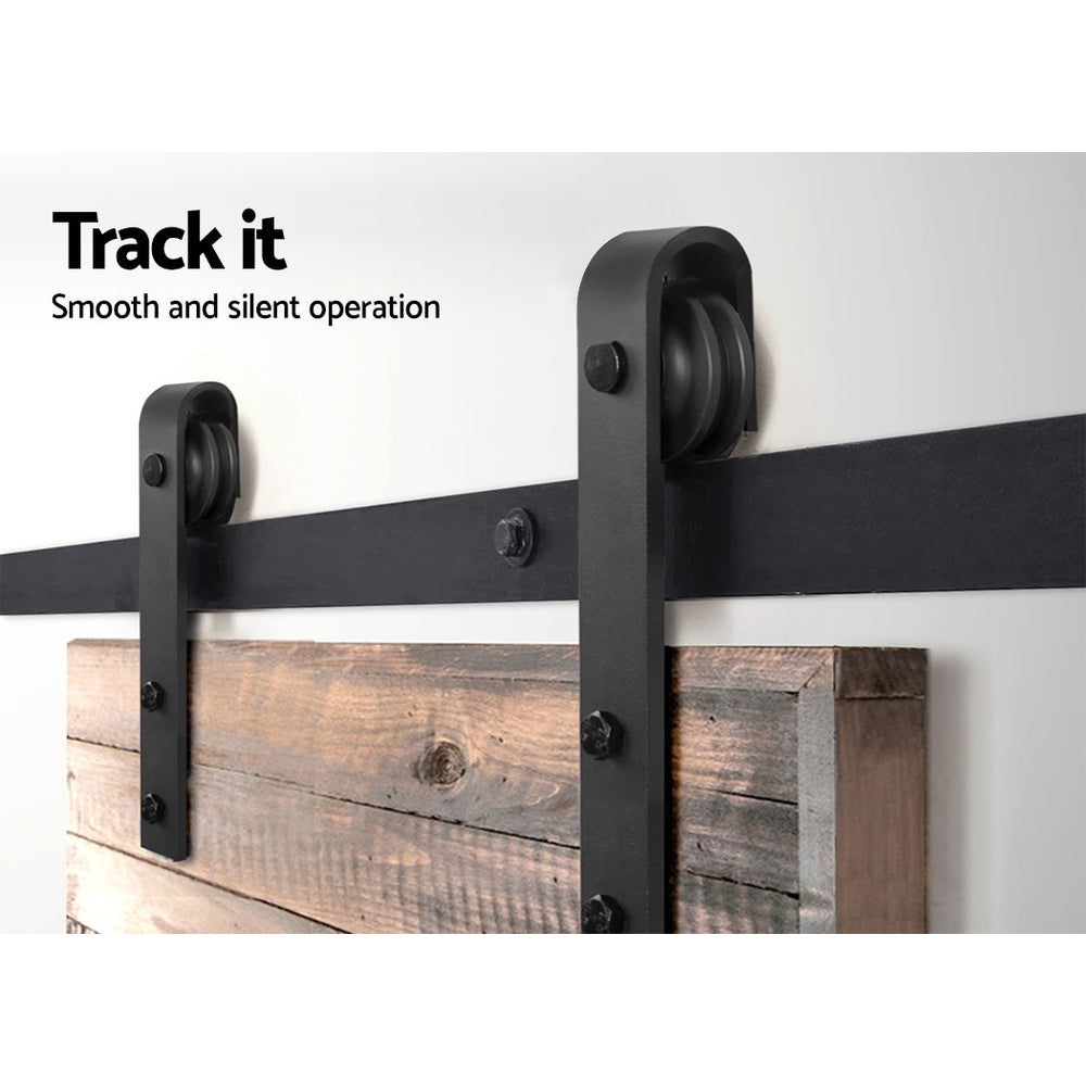 Barn door with black metal track and wooden panel on a white background