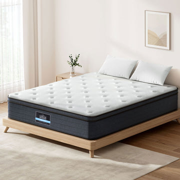 Mattress on a wooden bed frame in a bedroom setting with a neutral color scheme.
