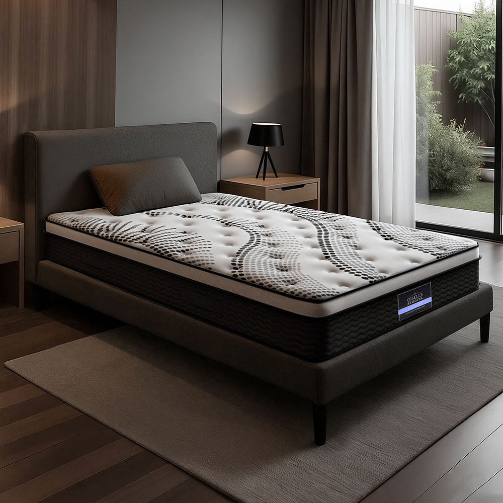 Mattress on a bed in a modern bedroom setting