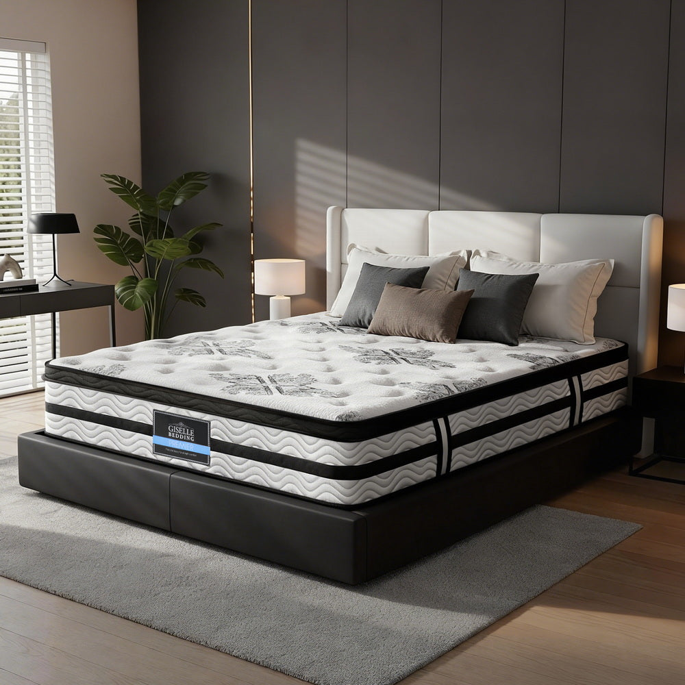 Mattress on a bed in a bedroom setting with decor elements.