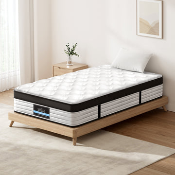 Mattress on a wooden bed frame in a bedroom setting