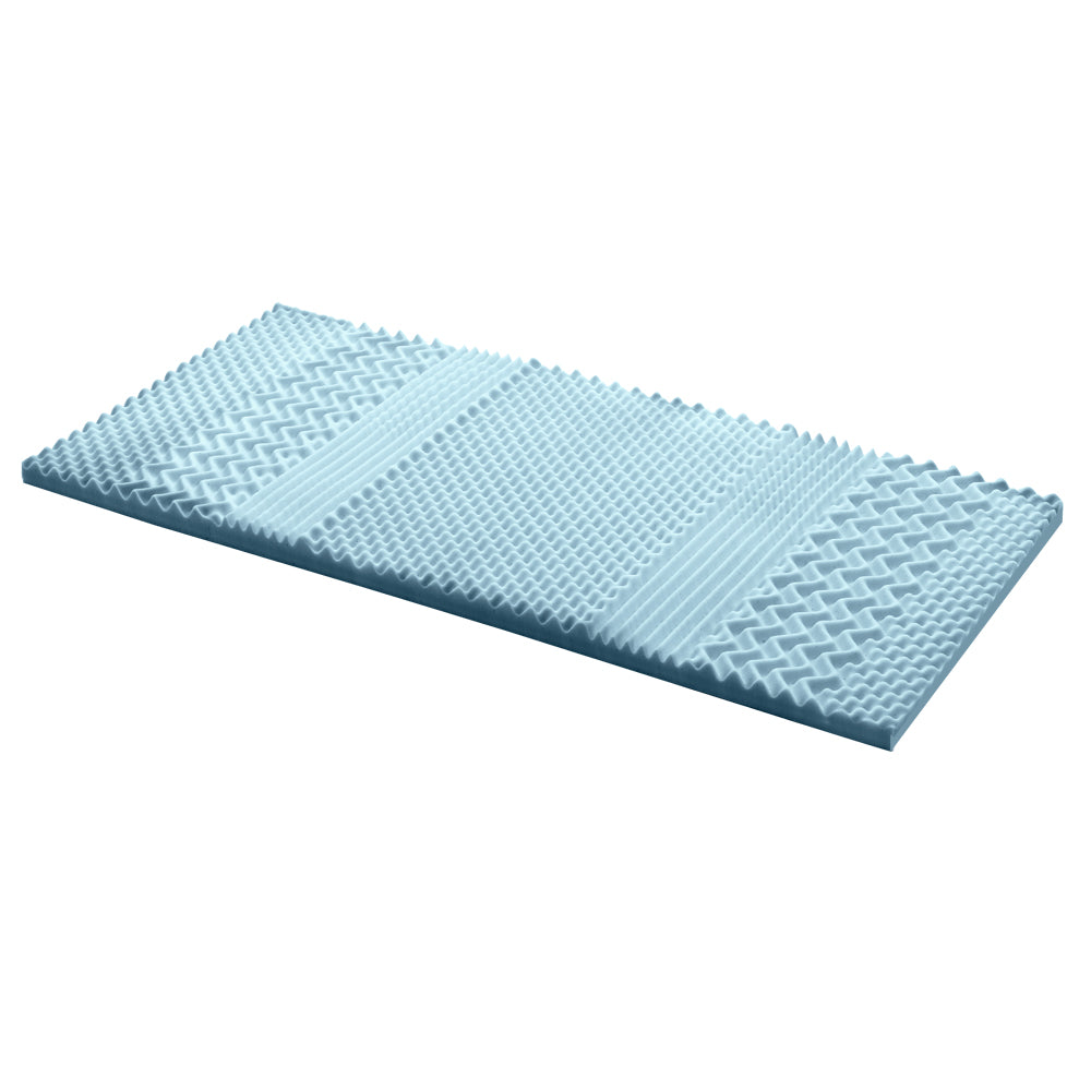 Blue foam mattress topper on a white background