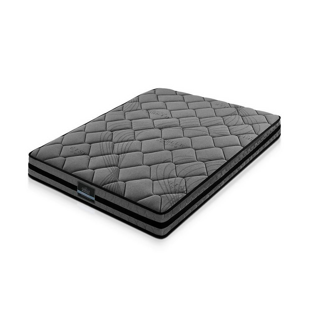 Gray quilted mattress on a white background