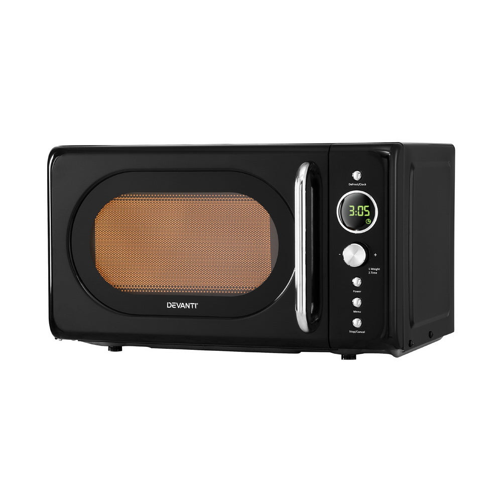 Black microwave oven with digital display on a white background