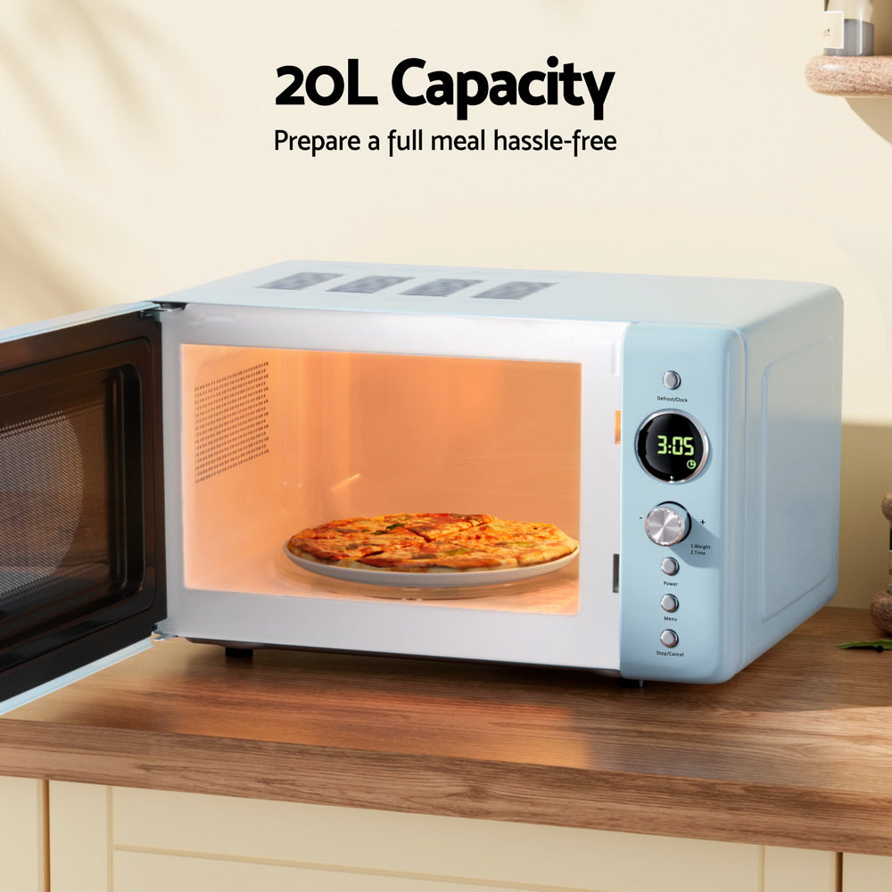 Microwave oven with a pizza inside on a wooden countertop, labeled '20L Capacity'.