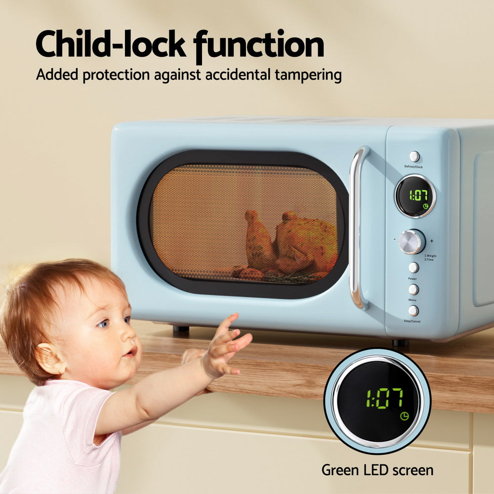 Baby reaching towards a blue microwave with child-lock function and green LED screen.