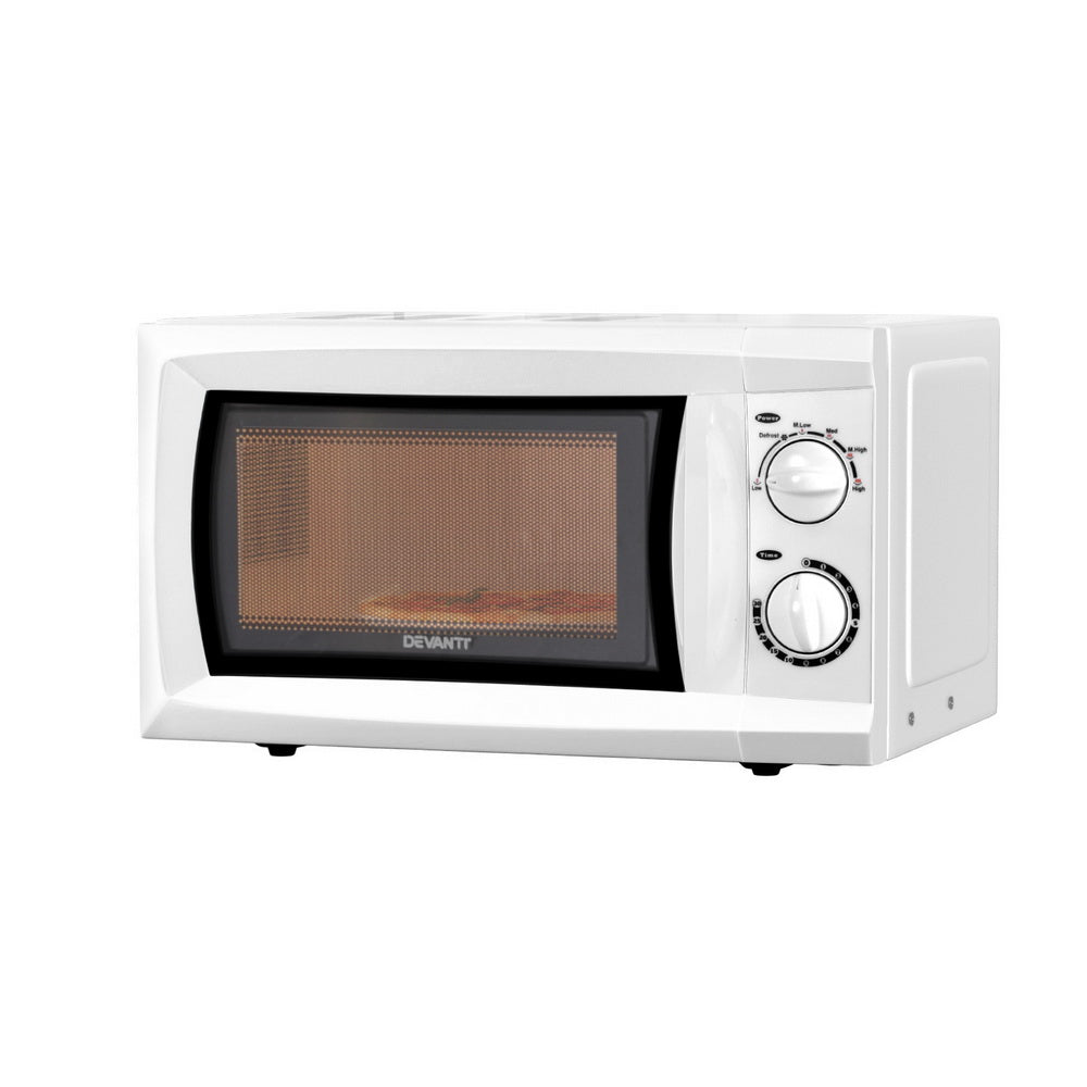 White microwave oven with black door on a white background