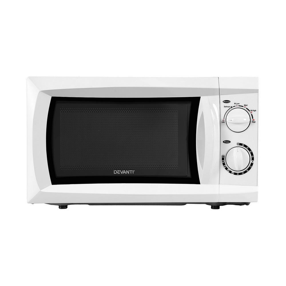 White microwave oven with black door on a white background