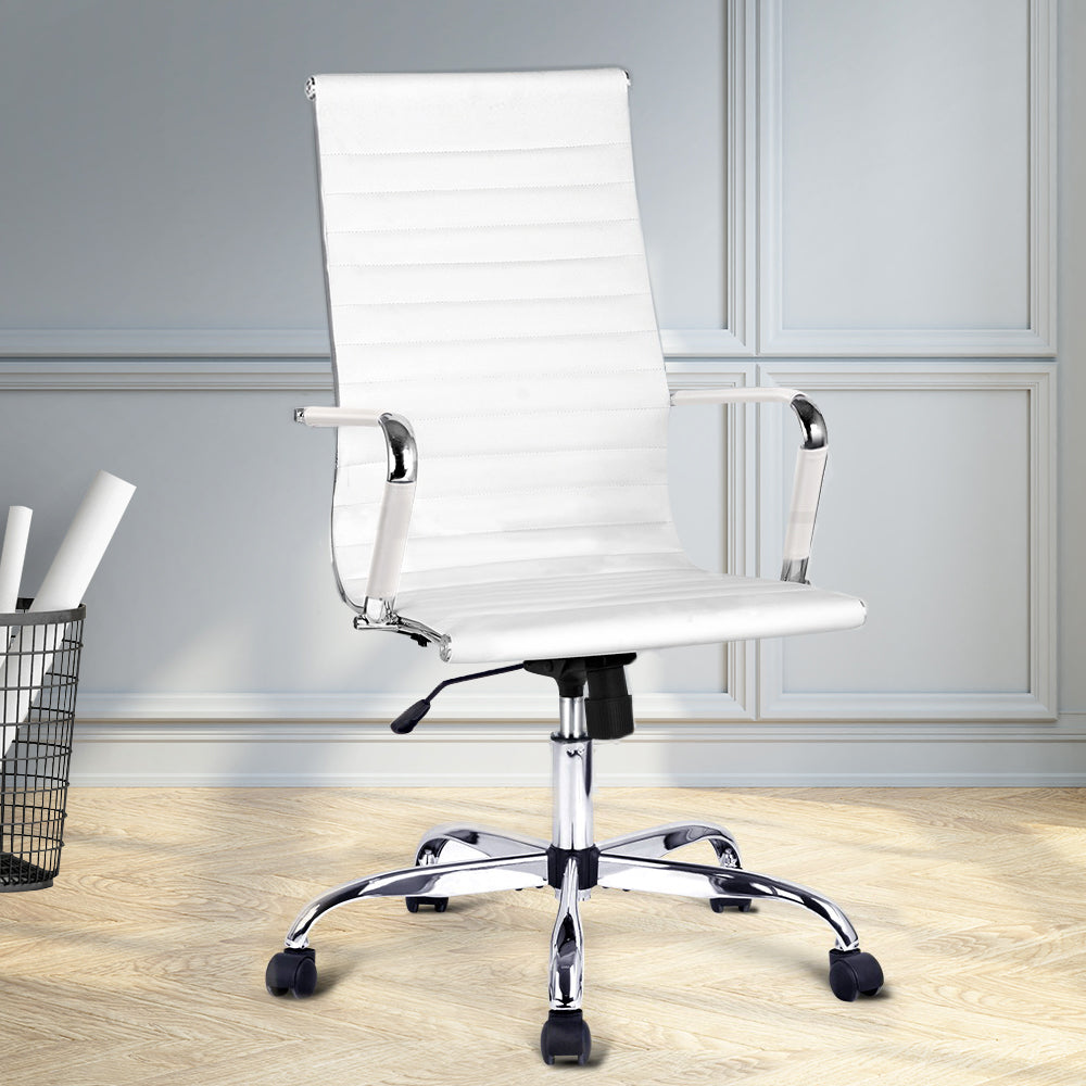White office chair with chrome accents in a room with light-colored walls and wooden floor.