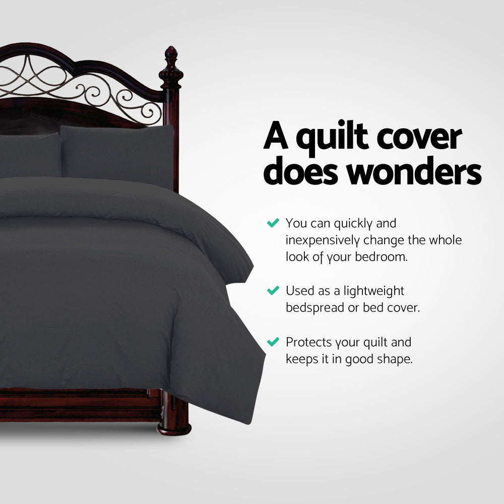 Gray quilt cover on a bed with text highlighting its benefits