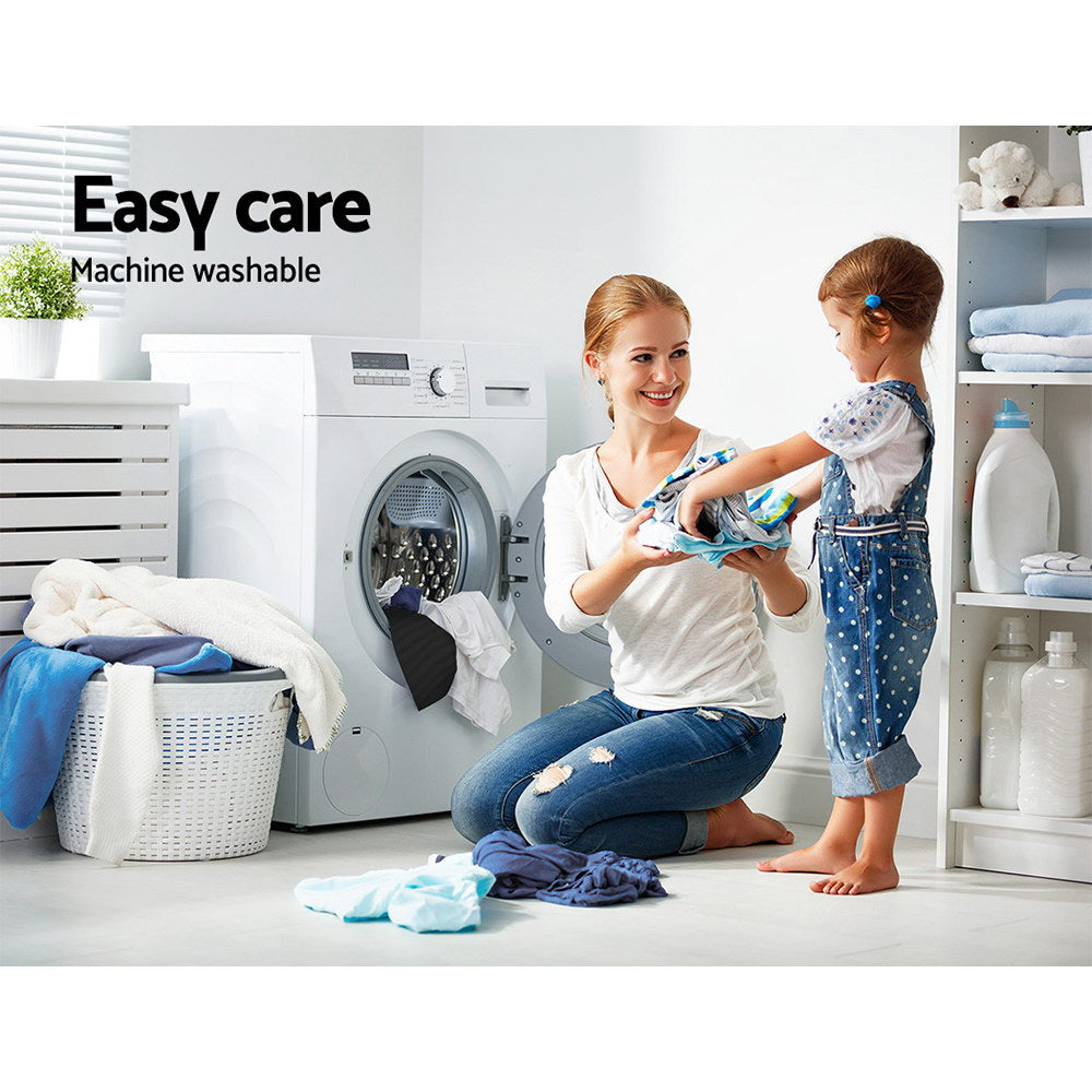 Woman and child with laundry in a bright room, featuring text 'Easy care Machine washable'.