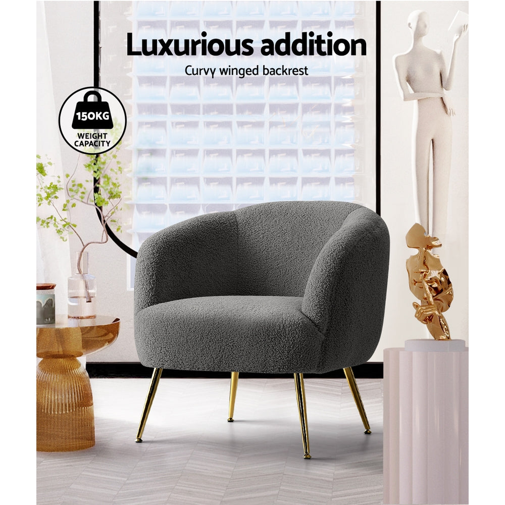Gray armchair with gold legs in a modern interior setting, featuring text about weight capacity.