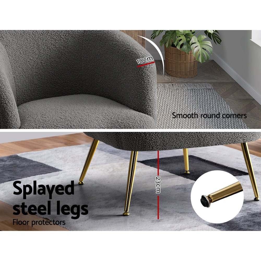 Gray chair with splayed steel legs and smooth round corners on a wooden floor.