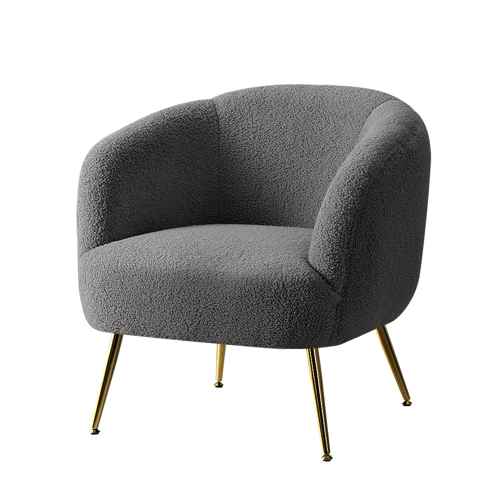 Gray boucle armchair with gold legs on a white background