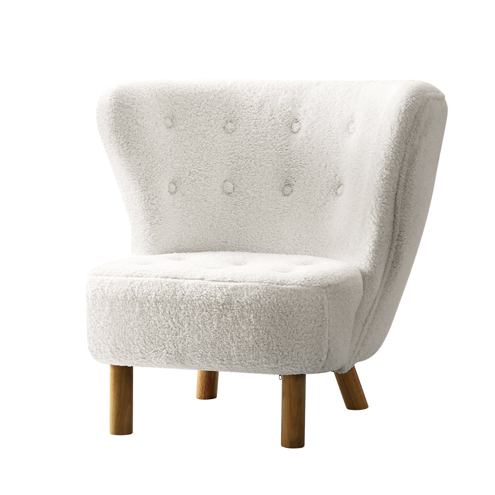 White textured armchair with wooden legs on a white background