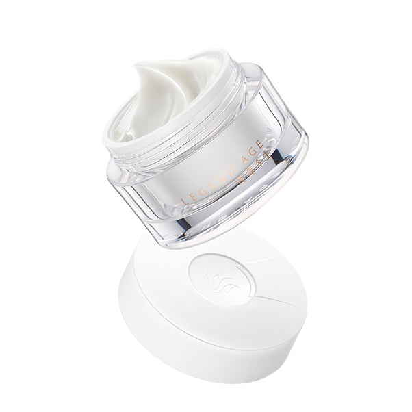 White skincare jar with a clear lid on a white background
