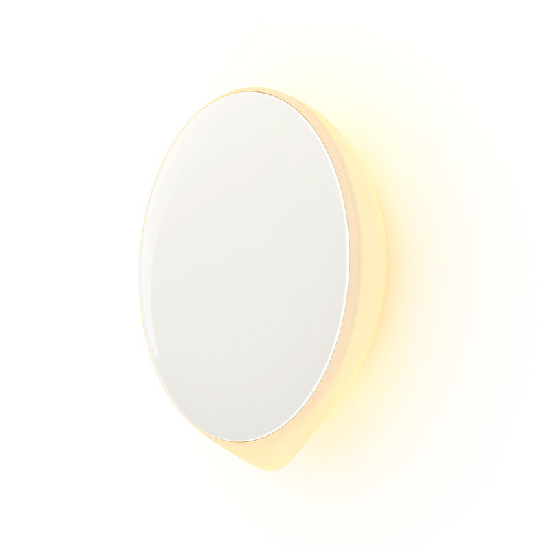 Round wall light with white and yellow gradient on a white background