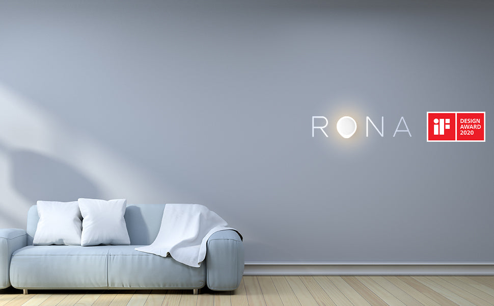 Gray sofa against a light gray wall with Rona logo and iF Design Award badge.