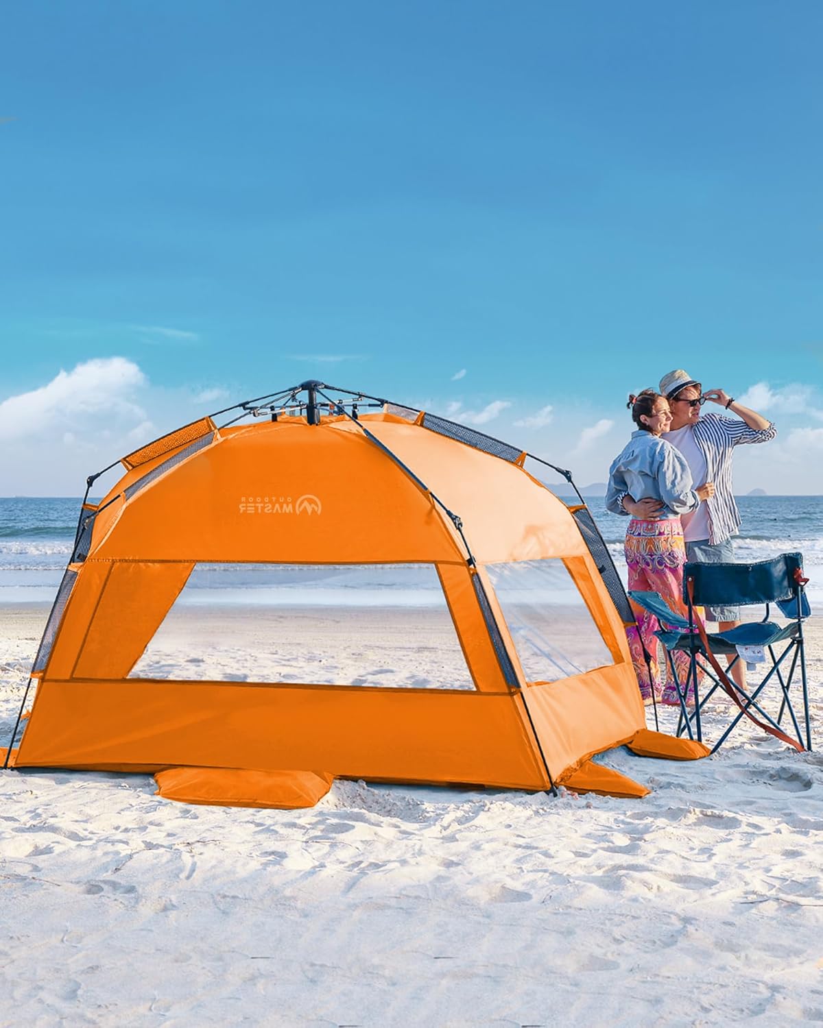 Orange pop-up tent on a sandy beach with people in the background