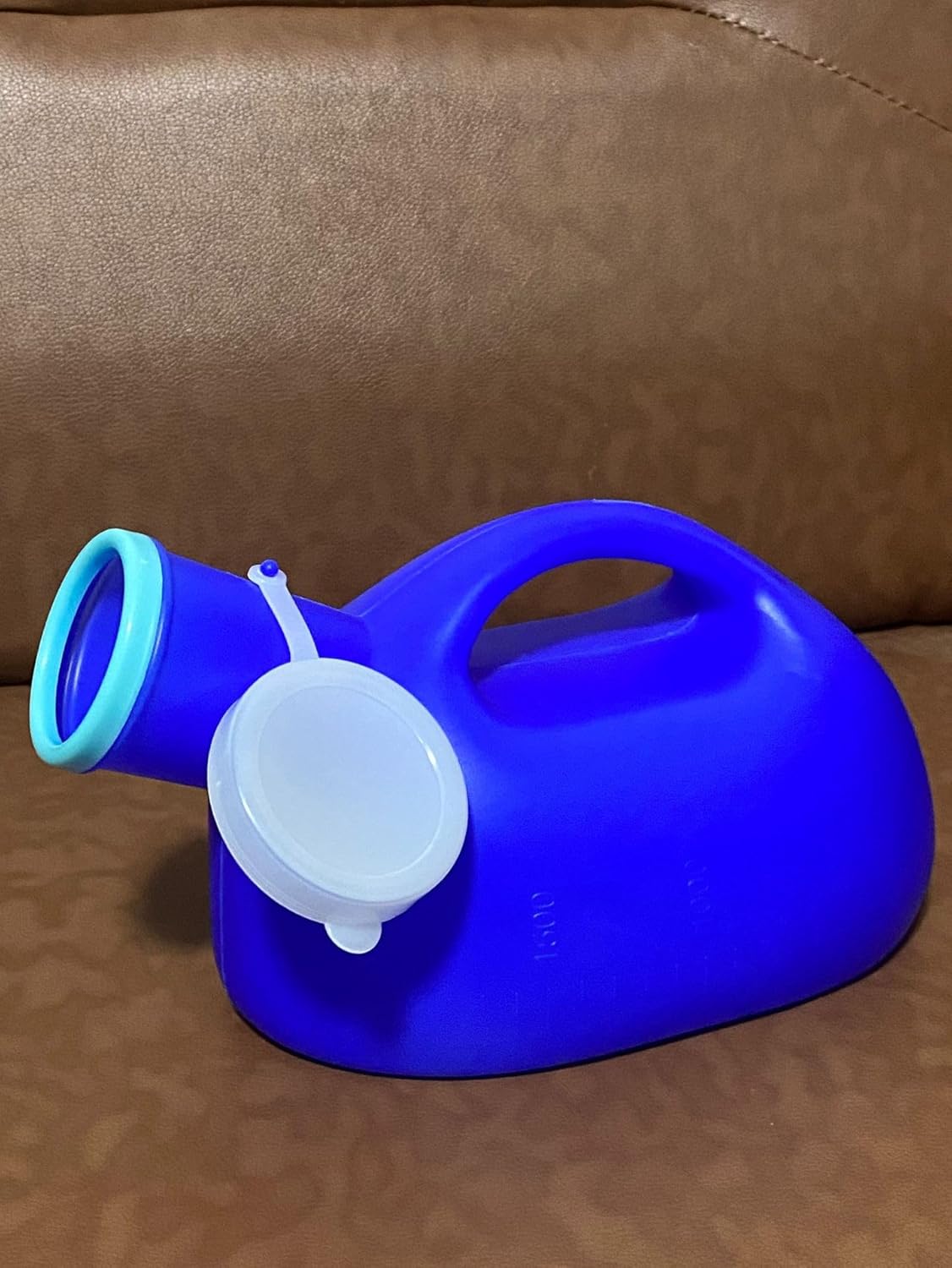 Blue plastic container with a white lid on a brown surface