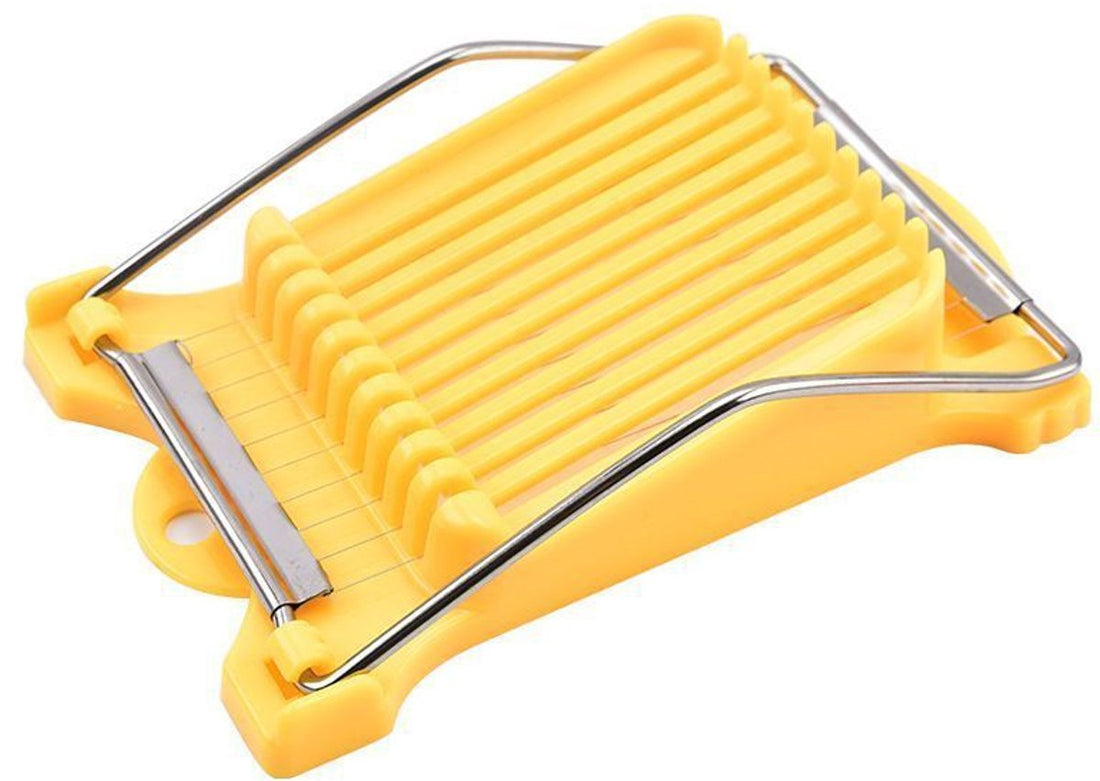 Yellow vegetable peeler with metal blades on a white background