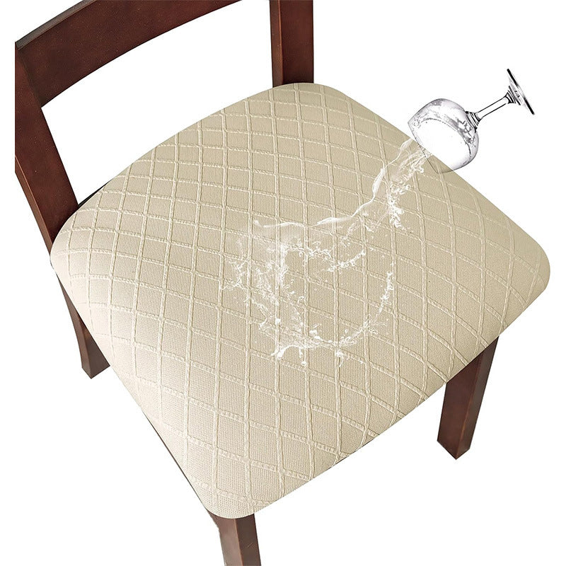 Beige chair pad with a wine glass being poured on it, on a white background