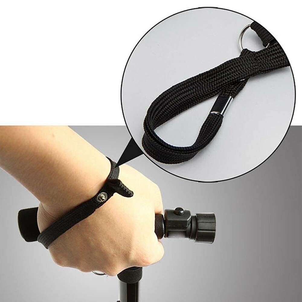 Hand holding a black adjustable strap with close-up of the strap on a gray background