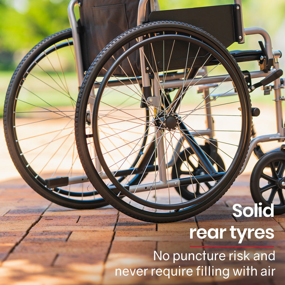 Wheelchair with solid rear tires on a wooden surface, with text highlighting their benefits.