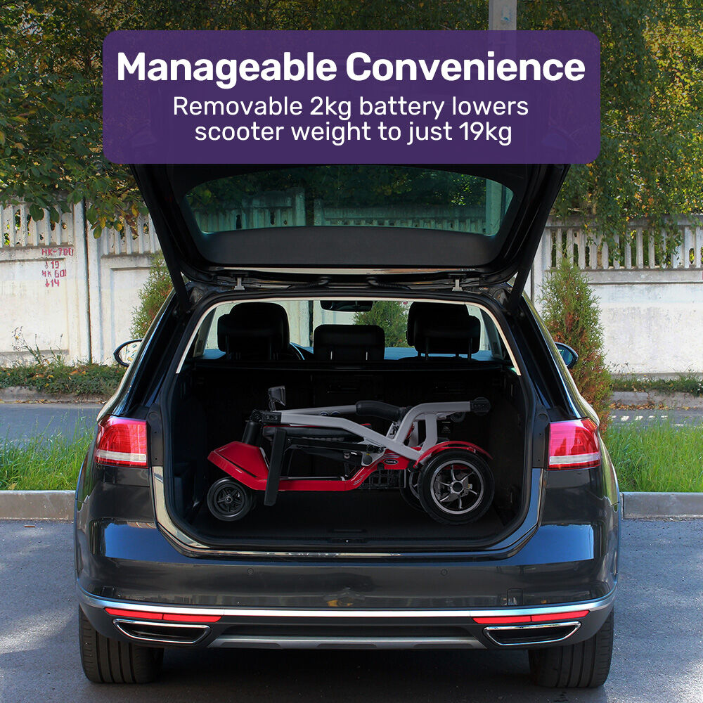 Scooter in a car trunk with text about a removable 2kg battery.