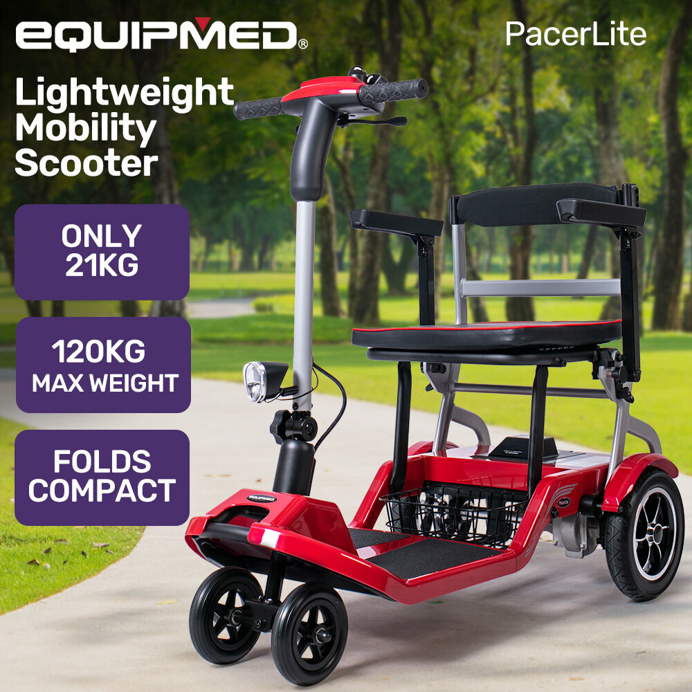 Red mobility scooter with black seat in a park setting, featuring EQUIPMED branding.