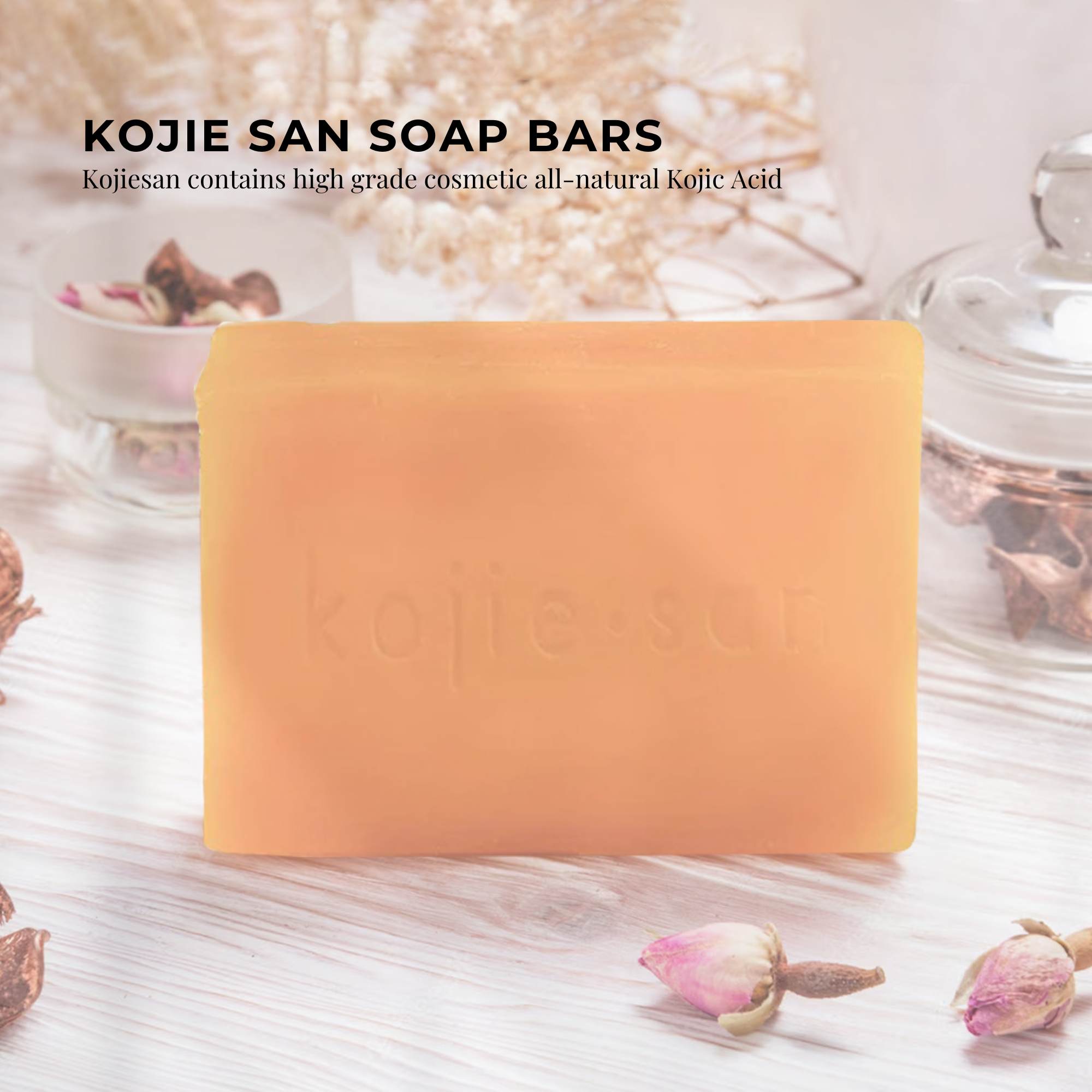 Kojie San soap bar on a light wooden surface with decorative elements.