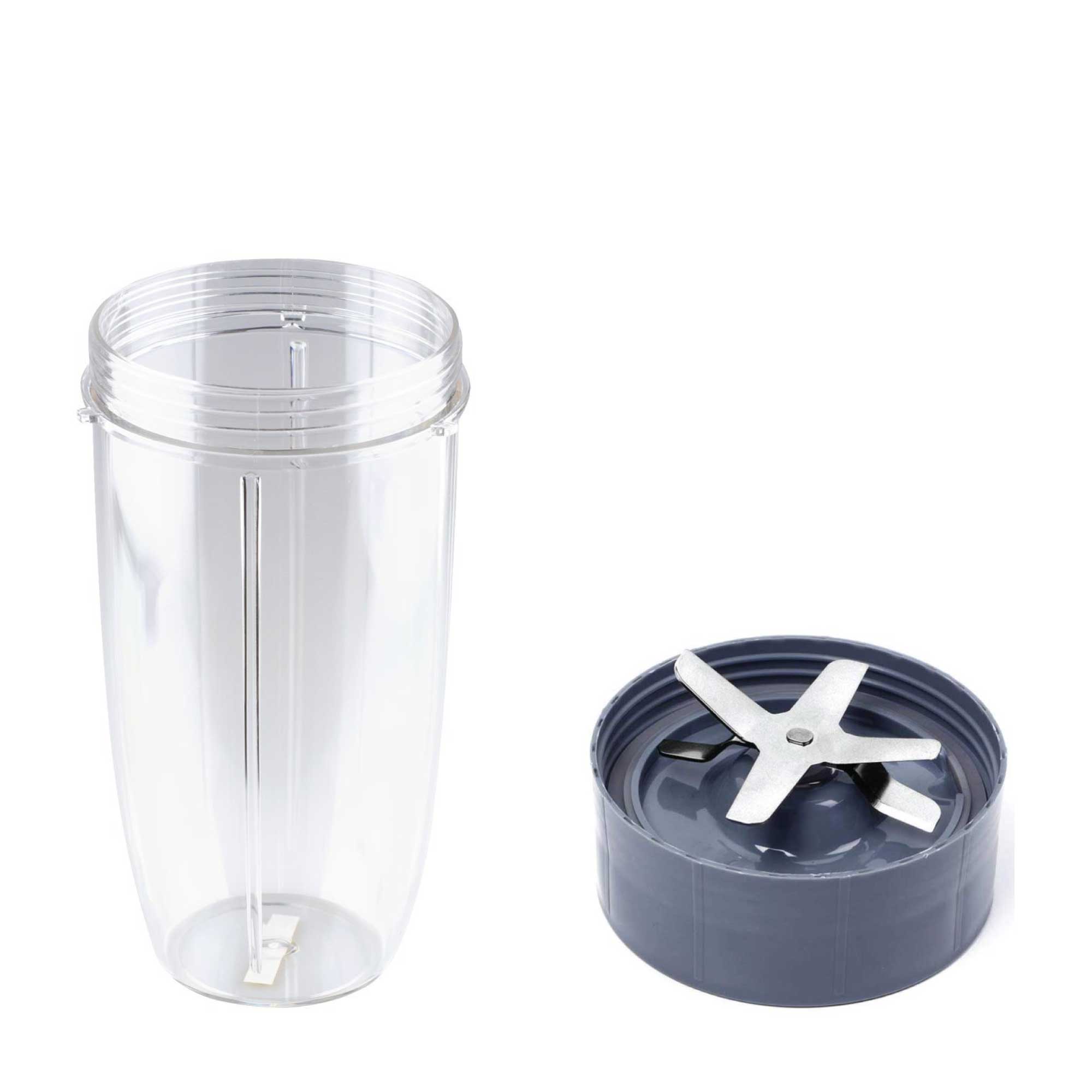 Clear blender jar with a black base and white blades on a white background
