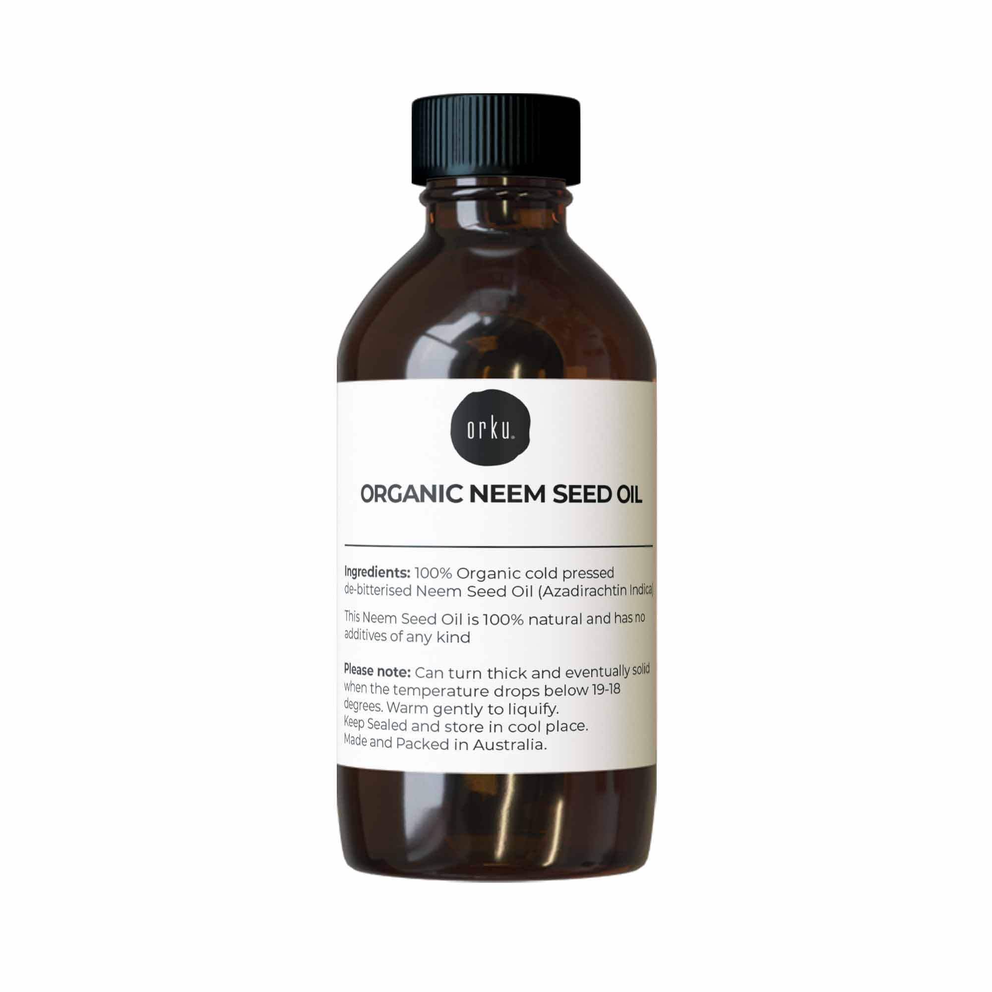Bottle of organic neem seed oil with a label on a white background