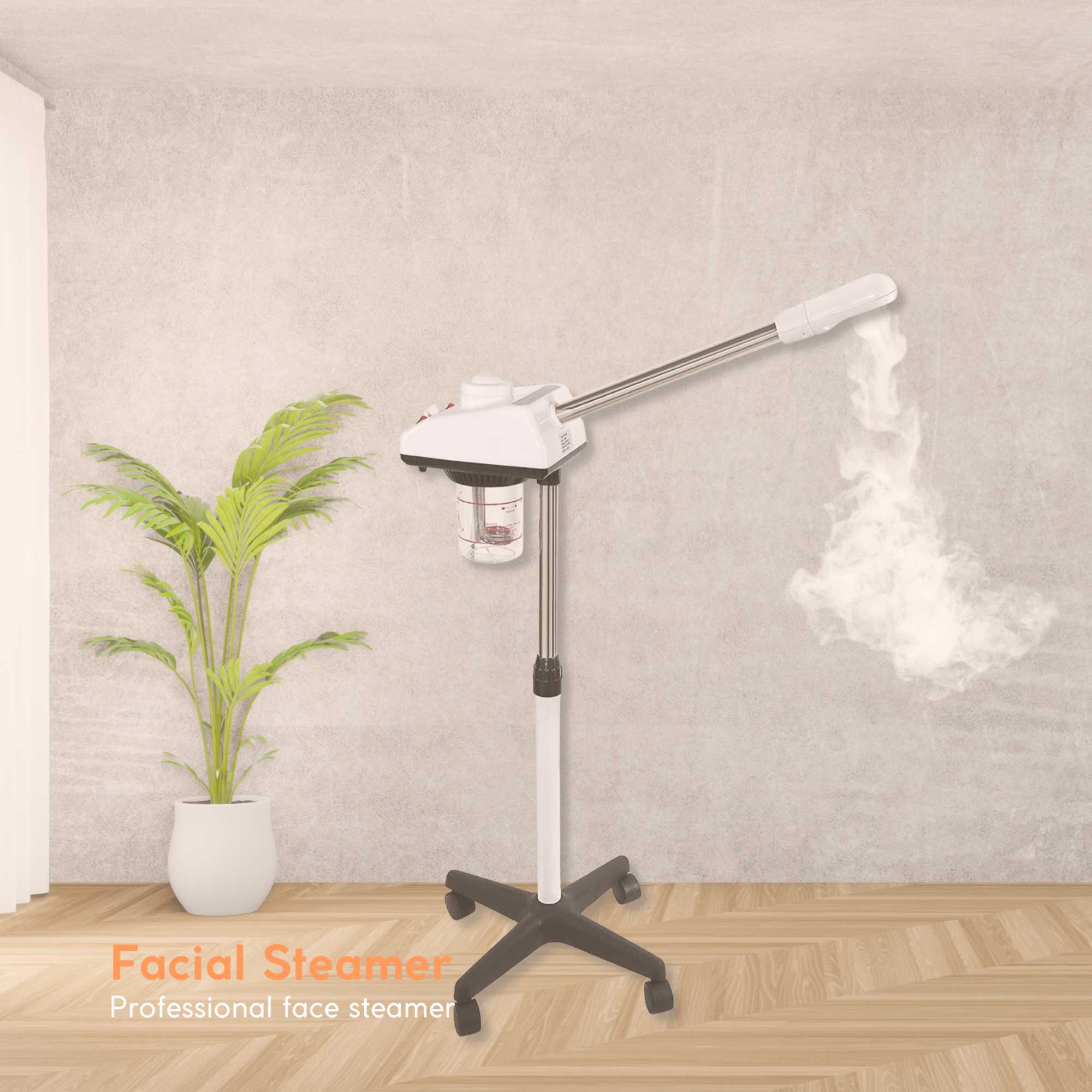 Facial steamer emitting steam in a room with a plant and light-colored wall.