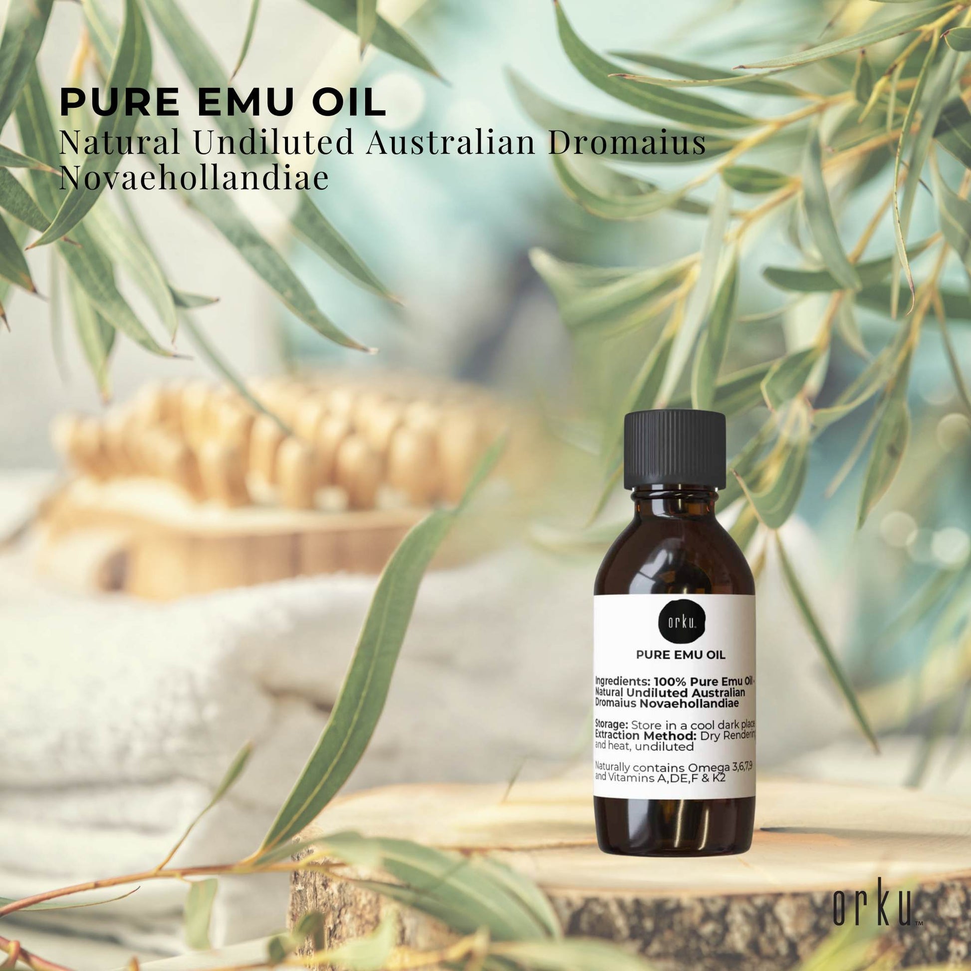 Bottle of pure emu oil with eucalyptus leaves in the background