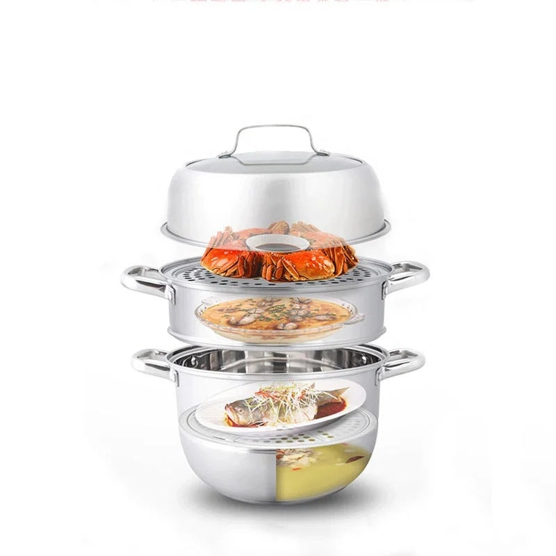 Three-tiered stainless steel steamer with food on a white background