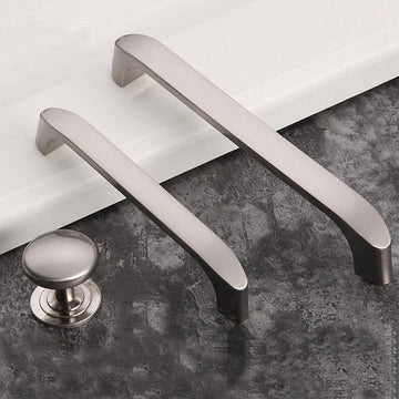 Metallic door handles on a textured surface