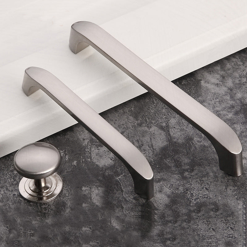 Metallic door handles on a textured surface