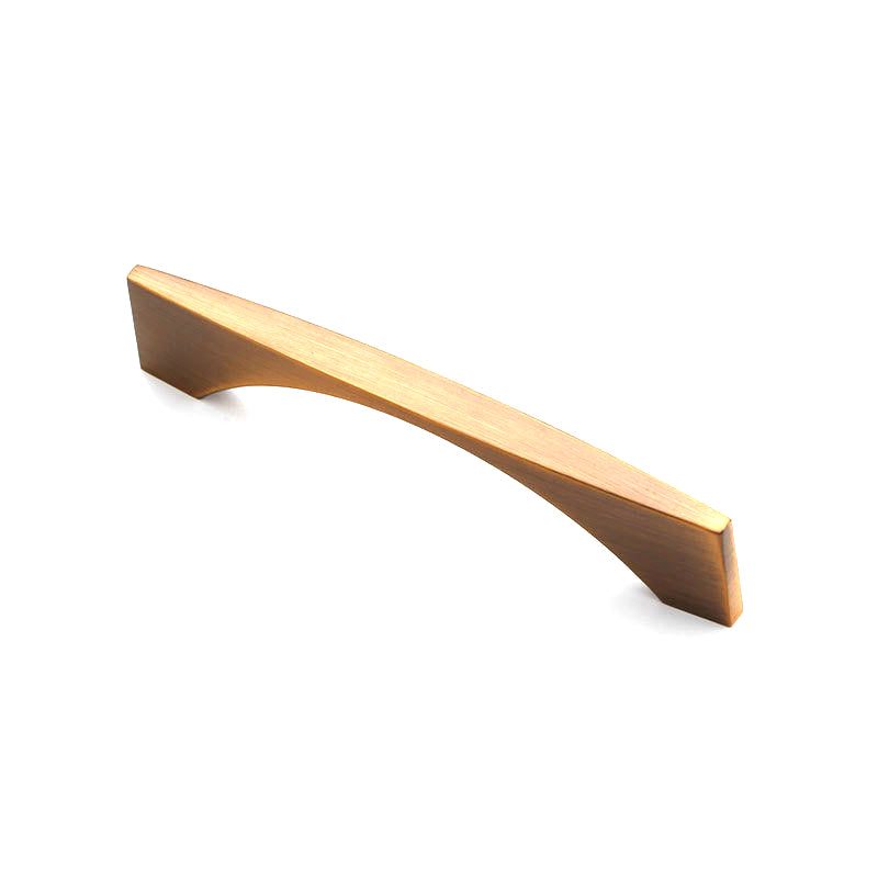Gold cabinet handle on a white background