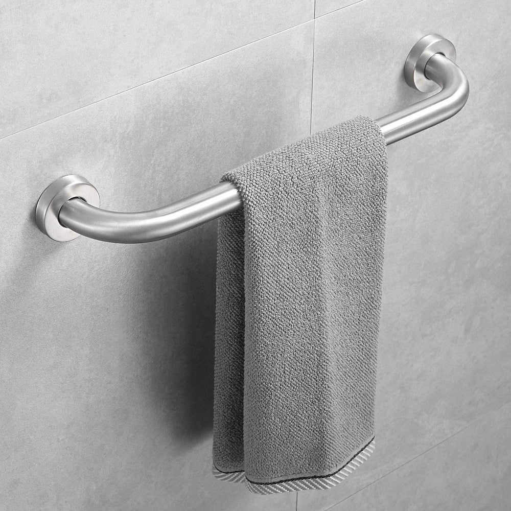 Gray towel hanging on a stainless steel grab bar against a tiled wall.