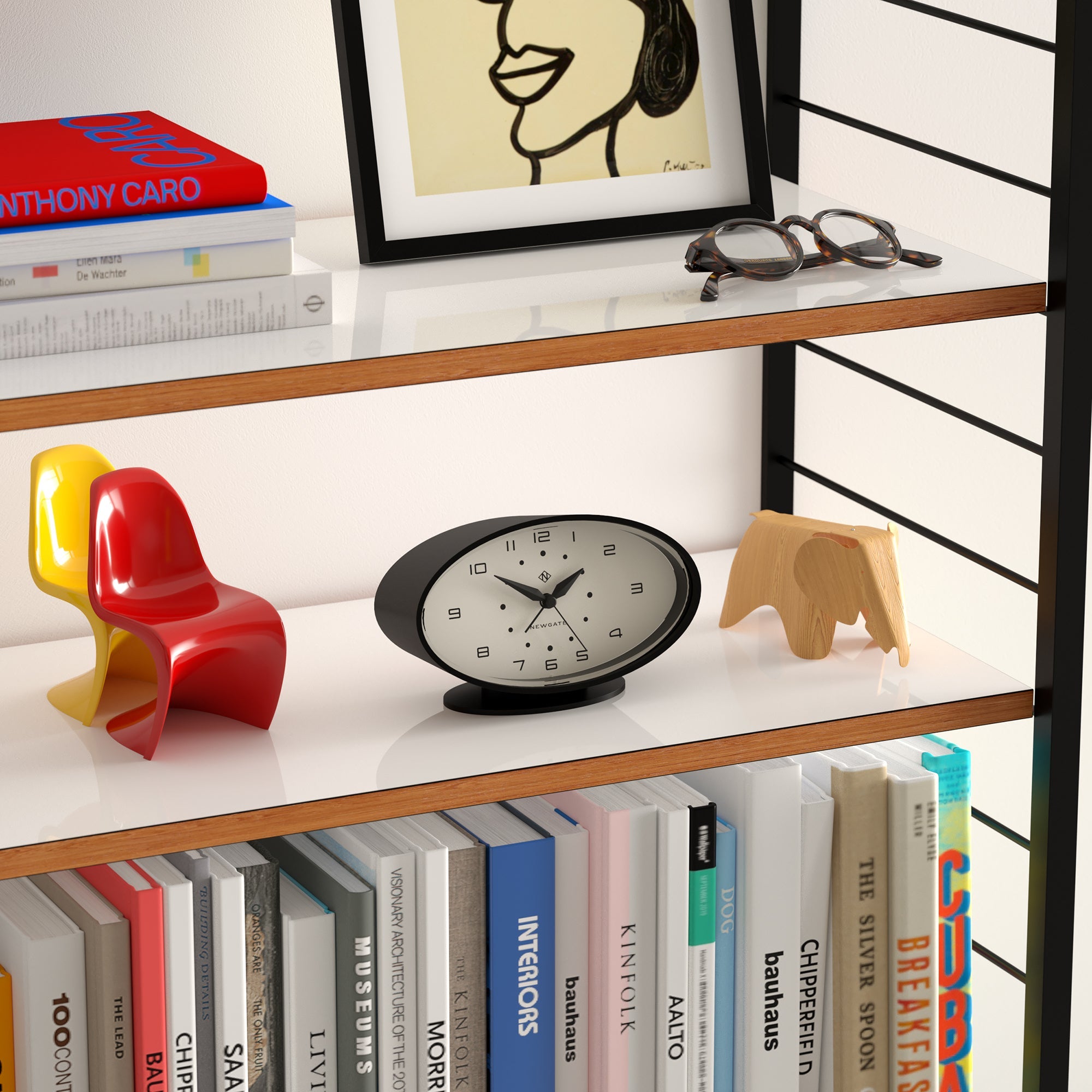 Bookshelf with books, a clock, and decorative items