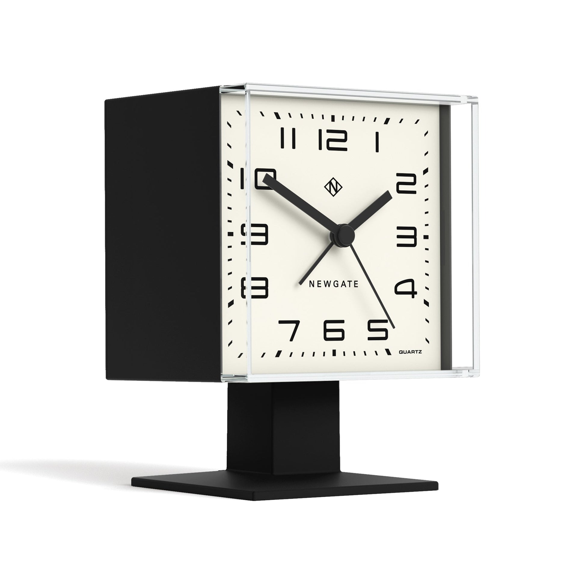 Black table clock with a white face on a white background