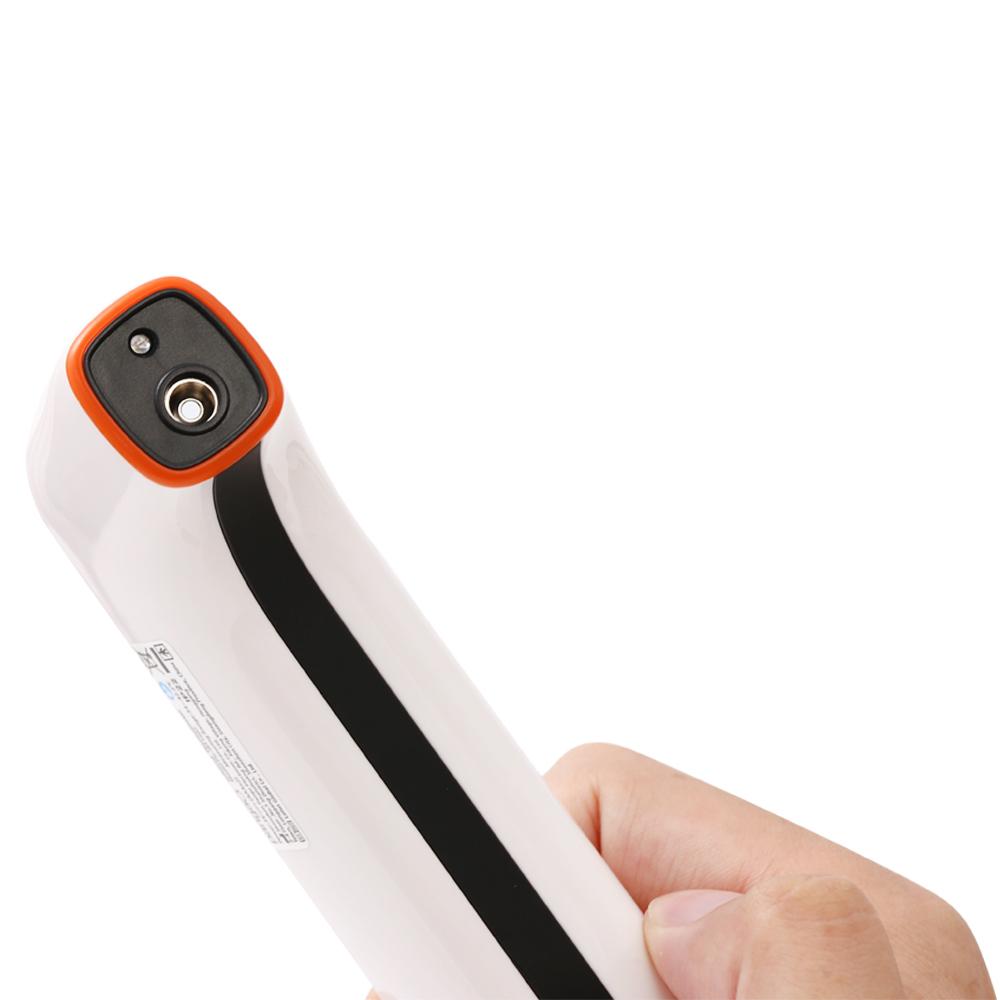 Hand holding a white and orange electronic device on a white background